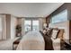 Spacious bedroom with large windows, neutral tones, and elegant decor at 6570 Parterre N Pkwy # 6, Thornton, CO 80602