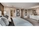 A spacious bedroom with light-colored walls, plush carpet, and stylish decor exudes comfort and elegance at 6570 Parterre N Pkwy # 6, Thornton, CO 80602