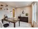 Functional home office with natural light, stylish desk, and organized storage solutions is perfect for remote work at 6570 Parterre N Pkwy # 6, Thornton, CO 80602