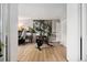 Home gym or bonus space with neutral walls, wood flooring, and ample space for fitness equipment at 7040 E Girard Ave # 207, Denver, CO 80224