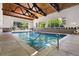 Community indoor pool area with large windows providing natural light at 7040 E Girard Ave # 207, Denver, CO 80224