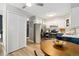Kitchen features bright white cabinets, stainless steel appliances, and eat-in table at 7040 E Girard Ave # 207, Denver, CO 80224