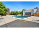Community outdoor pool with mature trees and an apartment building at 7040 E Girard Ave # 207, Denver, CO 80224