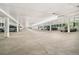 Expansive parking garage with several vehicles parked in designated spots at 7040 E Girard Ave # 207, Denver, CO 80224