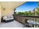 Cozy outdoor patio with comfortable seating, string lights, and a view of the surrounding greenery at 7040 E Girard Ave # 207, Denver, CO 80224