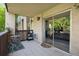 Relaxing patio with tile flooring, outdoor seating, and a sliding glass door leading to the interior space at 7040 E Girard Ave # 207, Denver, CO 80224