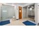 Clean and functional locker room showers featuring multiple stalls and ample space at 7040 E Girard Ave # 207, Denver, CO 80224