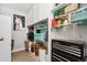 Organized storage room with built-in cabinets and shelving filled with various household items and tools at 7040 E Girard Ave # 207, Denver, CO 80224