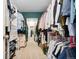Spacious walk-in closet with ample shelving and hanging space to organize clothing and accessories at 7040 E Girard Ave # 207, Denver, CO 80224