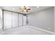 Bright bedroom with large closet and fresh gray paint at 3883 S Fraser St, Aurora, CO 80014