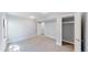 Bright bedroom with plush carpet, large closet space, and a neutral color scheme at 3883 S Fraser St, Aurora, CO 80014