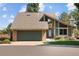 Charming two-story home featuring an attached two-car garage and landscaped front yard at 3883 S Fraser St, Aurora, CO 80014