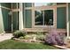 Charming front yard featuring lush landscaping and a welcoming entrance to the home at 3883 S Fraser St, Aurora, CO 80014