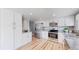Modern kitchen with stainless steel appliances, granite countertops, and ample cabinet space at 3883 S Fraser St, Aurora, CO 80014