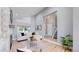 Bright living room with modern decor and open floor plan leading to staircase at 3883 S Fraser St, Aurora, CO 80014