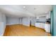 Open-concept living room space with hardwood floors, recessed lighting, and plenty of room at 3883 S Fraser St, Aurora, CO 80014