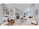 Bright living room with fireplace, built-in shelves, and ample seating at 3883 S Fraser St, Aurora, CO 80014