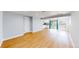 Spacious living room with hardwood floors and access to the patio and kitchen area at 3883 S Fraser St, Aurora, CO 80014