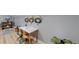 Bright office area features modern decor, light wood floors, and contemporary desk and shelving at 3883 S Fraser St, Aurora, CO 80014
