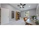 Functional home office with a comfortable chair, unique desk, and a ceiling fan at 3883 S Fraser St, Aurora, CO 80014