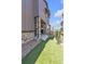 A cozy back yard with easy to maintain synthetic grass and stone accents at 8145 Monte Vista Cir, Littleton, CO 80125