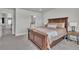 Neutral bedroom with large bed and decorative throw blanket and throw pillows at 8145 Monte Vista Cir, Littleton, CO 80125