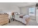 Bedroom with window, dresser and natural light at 8145 Monte Vista Cir, Littleton, CO 80125