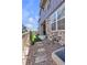 Side yard featuring rock accents, artificial grass, and wooden fence at 8145 Monte Vista Cir, Littleton, CO 80125
