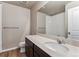 Stylish bathroom features a modern vanity, sleek mirror, and a clean, well-lit shower area at 4284 Gozzer Ranch Dr, Elizabeth, CO 80107