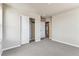 Inviting bedroom featuring soft carpet, neutral paint, and ample closet space for organized living at 4284 Gozzer Ranch Dr, Elizabeth, CO 80107