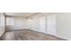 Spacious open living area with light colored wood floors at 4284 Gozzer Ranch Dr, Elizabeth, CO 80107