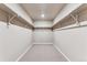 Walk-in closet with built-in shelving system for organized storage at 4284 Gozzer Ranch Dr, Elizabeth, CO 80107