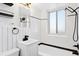 Modern bathroom with white subway tiles and black fixtures at 1101 Bellaire St # 108, Denver, CO 80220