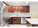 Modern kitchen with stainless steel appliances and white counters at 1101 Bellaire St # 108, Denver, CO 80220