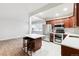 Eat-in kitchen with island and hardwood floors at 1101 Bellaire St # 108, Denver, CO 80220