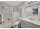 Bathroom with white tiled shower and tub, wooden floors, white vanity, and gray walls at 4110 Hale Pkwy Pkwy # 4J, Denver, CO 80220