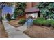 Building entrance with stairs surrounded by landscaping and exterior green shrubbery at 4110 Hale Pkwy Pkwy # 4J, Denver, CO 80220