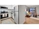 Modern kitchen open to the living room, featuring stainless steel appliances at 4110 Hale Pkwy Pkwy # 4J, Denver, CO 80220