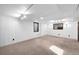 Finished basement boasts neutral carpeting, a window, and recessed lighting at 625 Ammons St, Lakewood, CO 80214