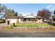 Charming ranch-style home with an inviting front yard, mature trees, and a well-maintained lawn at 625 Ammons St, Lakewood, CO 80214