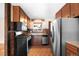 Well-equipped kitchen with wood cabinets, stainless steel refrigerator, and a vintage design at 625 Ammons St, Lakewood, CO 80214