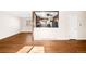 Bright living room with hardwood floors, connecting to the kitchen, creating an open and airy space at 625 Ammons St, Lakewood, CO 80214
