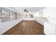 Spacious sunroom with modern flooring, ample natural light, and a washer and dryer at 625 Ammons St, Lakewood, CO 80214