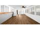 Large sunroom featuring sleek flooring, multiple windows, and modern appliances at 625 Ammons St, Lakewood, CO 80214
