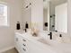 Bright bathroom featuring a dual sink vanity, modern fixtures, and elegant countertop at 8260 E 36Th Ave # 29, Denver, CO 80238