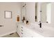 Modern bathroom with double vanity, quartz countertops, and black fixtures at 8260 E 36Th Ave # 29, Denver, CO 80238