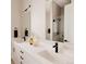Bright bathroom featuring a dual sink vanity, modern fixtures, and elegant countertop at 8260 E 36Th Ave # 29, Denver, CO 80238