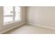 Bright and airy bedroom featuring neutral color palette and large window at 8260 E 36Th Ave # 29, Denver, CO 80238