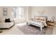 Sunlit bedroom with neutral tones, an area rug, and stylish side tables at 8260 E 36Th Ave # 29, Denver, CO 80238
