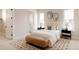 Inviting bedroom featuring a comfortable bed, modern decor, and natural light at 8260 E 36Th Ave # 29, Denver, CO 80238